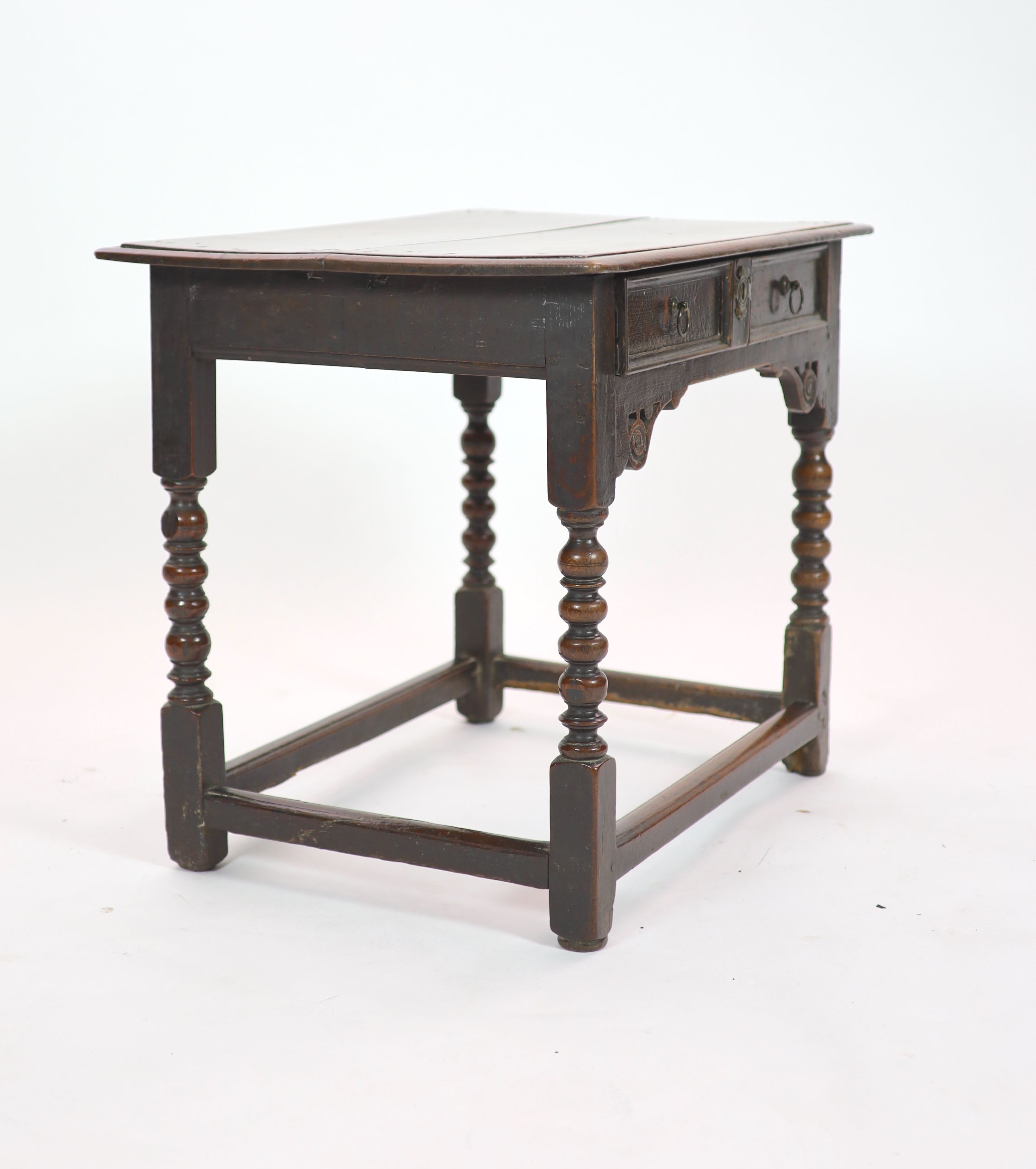 A Charles II oak side table H 68cm. W 82cm. D 56cm.